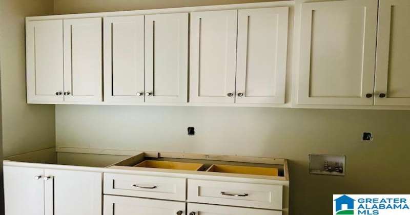 There will be crown molding installed at the top of the top of the upper cabinets.