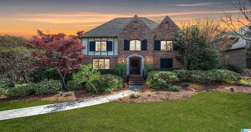 In the heart of Hoover, AL, this executive home is behind the gate in Lake Trace
