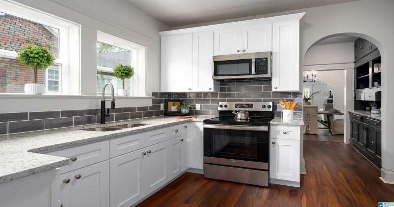 Kitchen features all new cabinets, granite counter tops, new flooring, sink all new kitchen appliances.