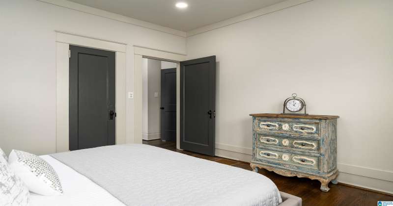 The primary bedroom is located inside it's own suite at the back of the home for privacy.